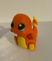 Orange knitted-style 3D printed Pokémon-inspired fire character with textured yarn-like surface and yellow belly, shown from a side angle on a white background.